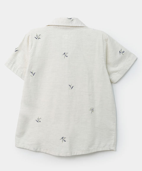 Camisa manga corta para bebé niño en algodón color marfil con estampado de hojas